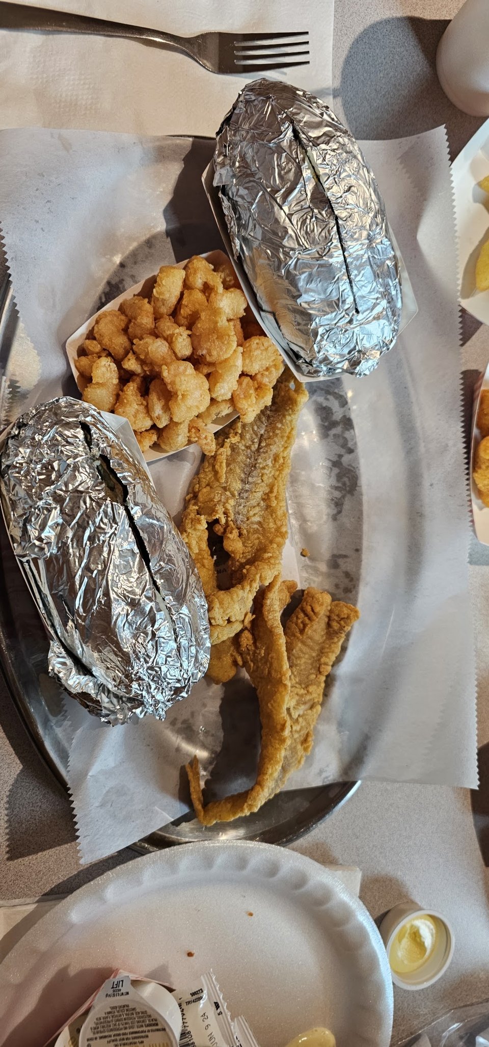 Plated seafood meal on a simple table.